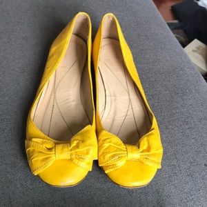 Kate Spade yellow ostrich leather bow flats size 8